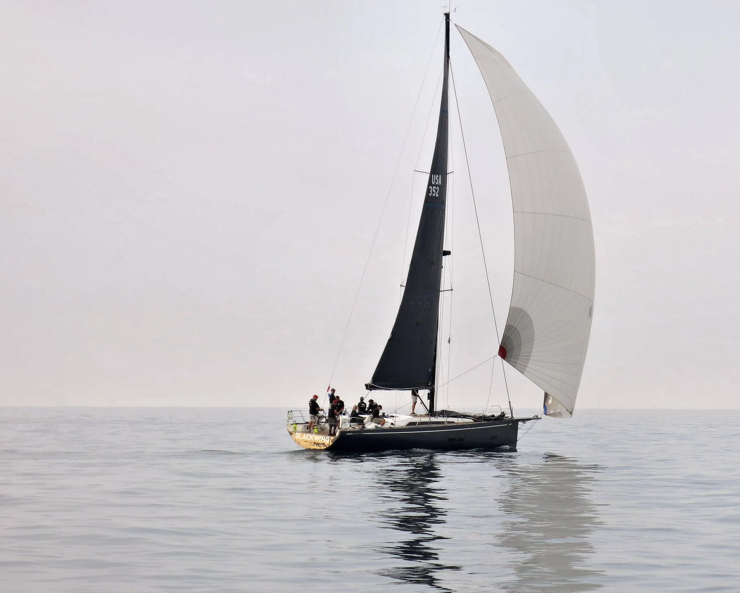 Blackwing from astern under full sail